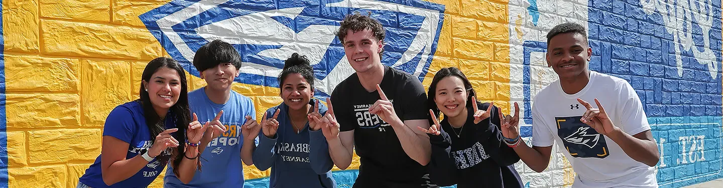 International Students throwing the Lopes 