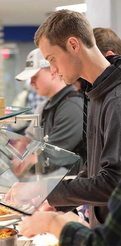 A Sodexo employee preparing food in the Graze